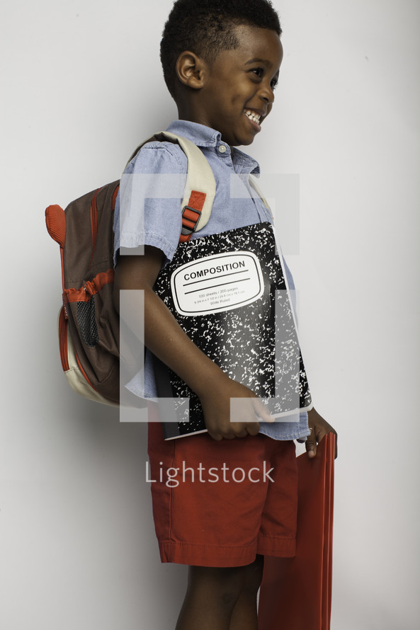 a boy child ready for school 