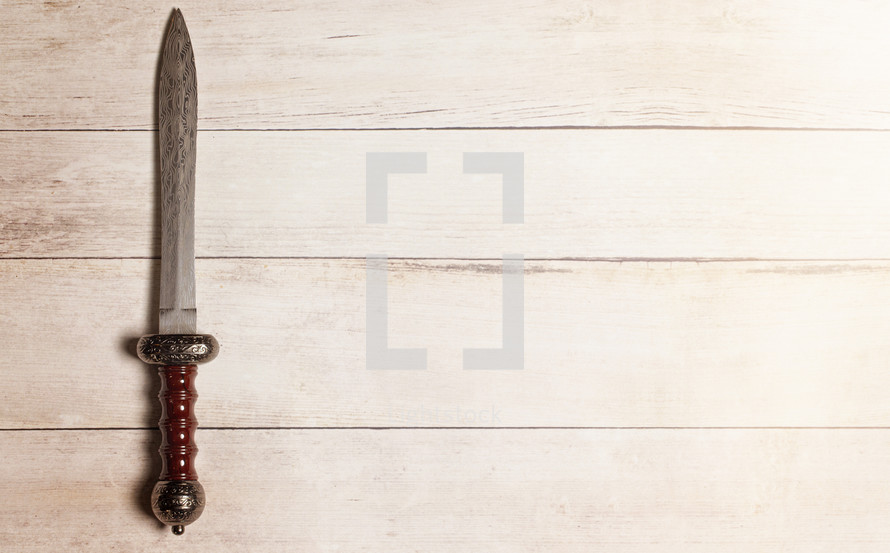 sword on a wood background 