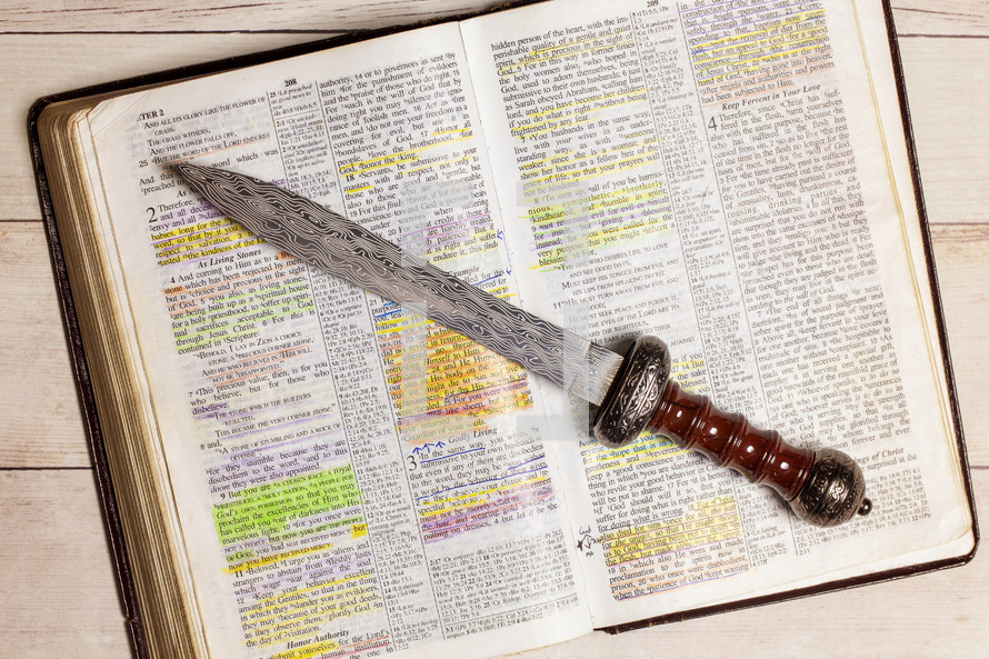Sword on the pages of a Bible 