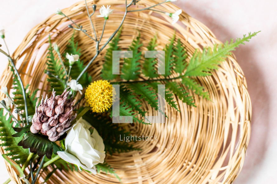 flowers and ferns in baskets 