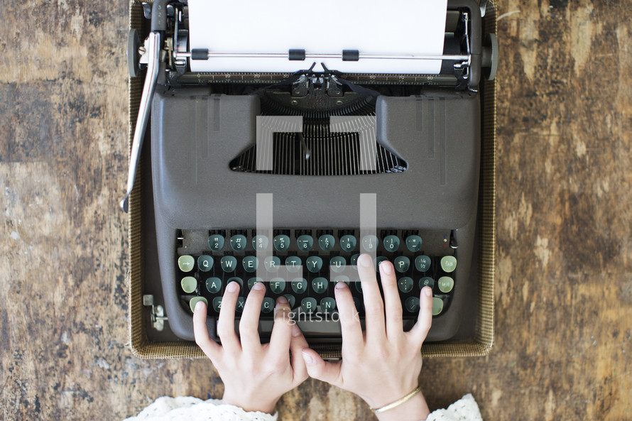 hands on a typewriter 