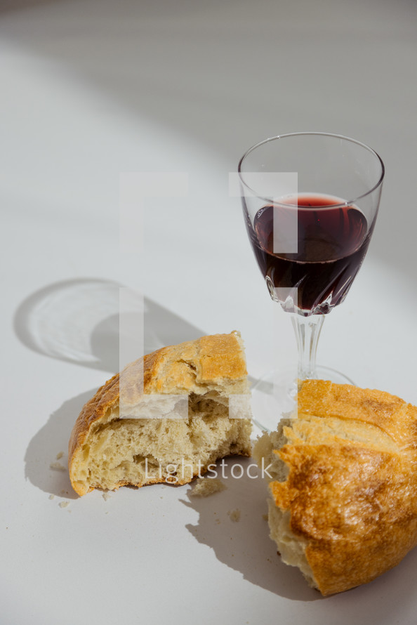 communion bread and wine on a white background 