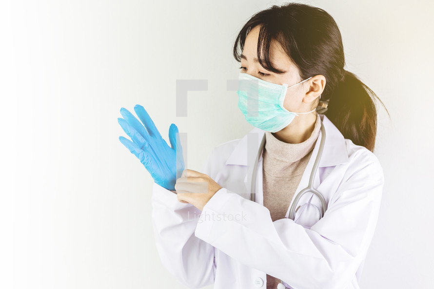 doctor putting on gloves 