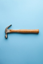 A hammer on a blue background.