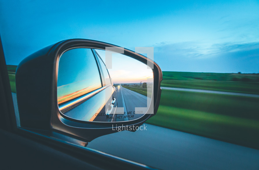 view in the side mirror of a car