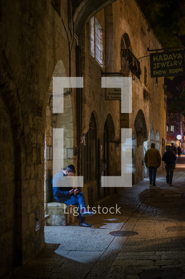 people walking sidewalks in Jerusalem 