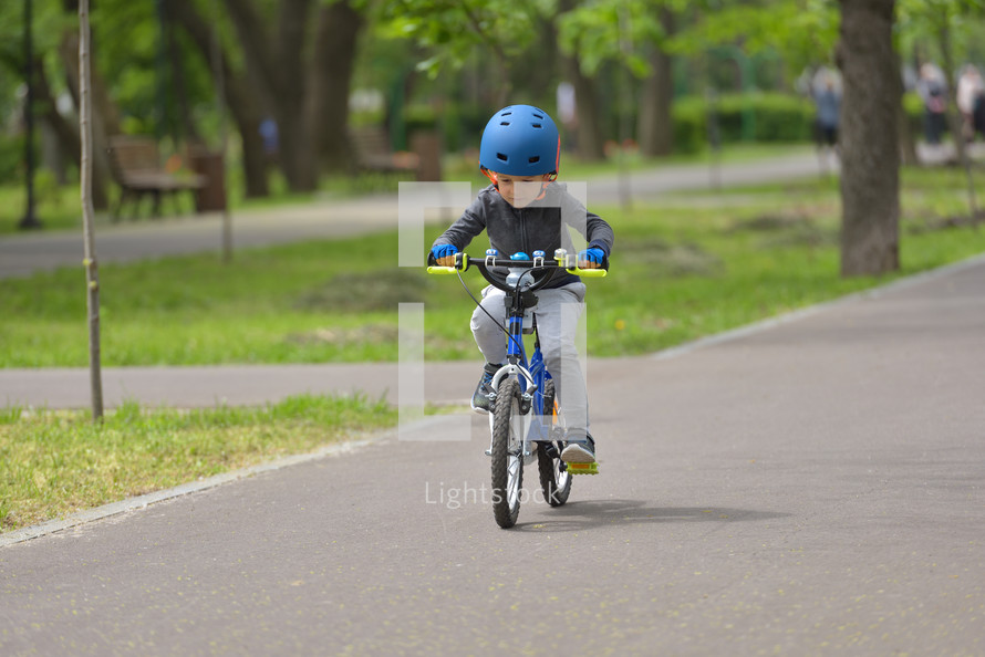 boy on a bike with a helmet 