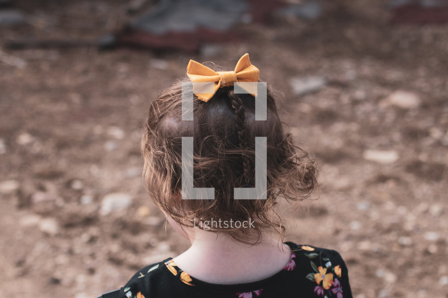 child with a hair bow 