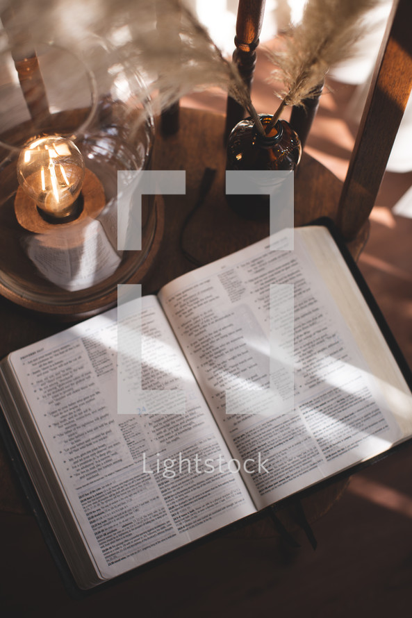 lantern and Bible in a chair 