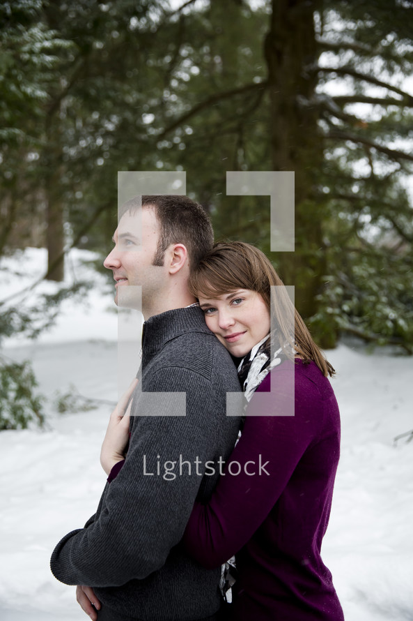 man and woman hugging outdoors 