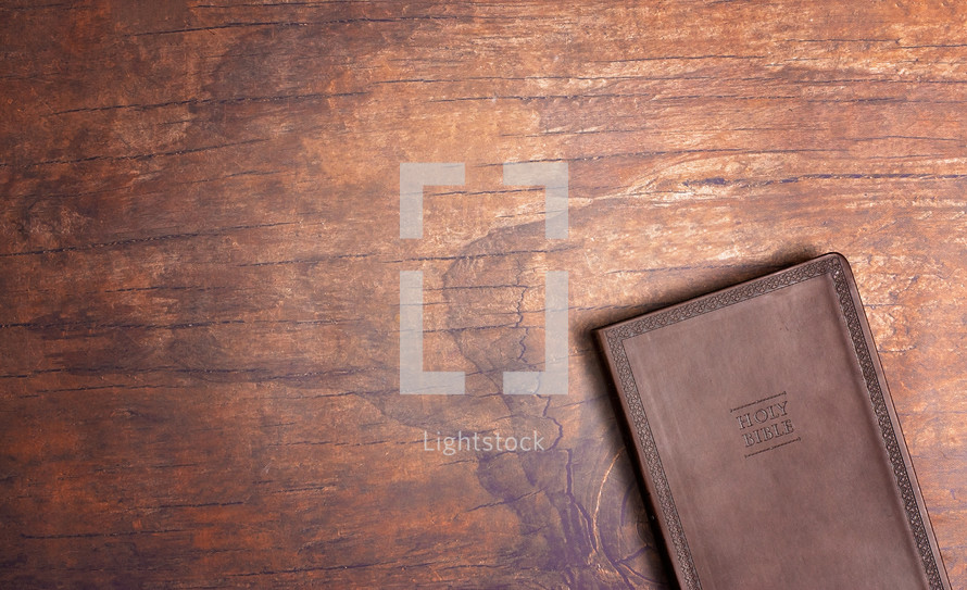 Bible on a wood background 