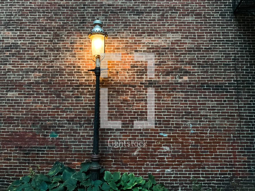 street lamp and brick wall 