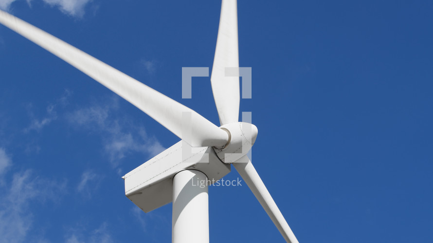 High power Wind turbine with clear sky behind it