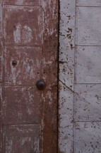 doorbell on a rusty metal door 