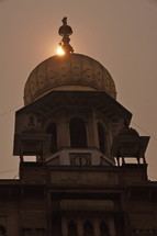 indian temple roof at sunset