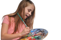 girl child holding a paint pallet 