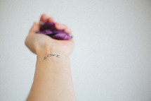 love tattoo on a wrist 