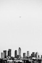 plane flying over a city 