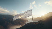 White surrender flag blowing in the wind on a mountain.