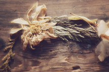 Dried flowers on a wooden background.