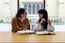 young women studying scripture 
