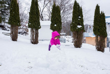 kids building a snowman 