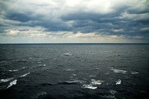 cloudy sky over a churning sea