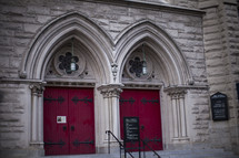 red doors to a church 
