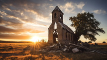 An old church building wasting away at sunset. 
