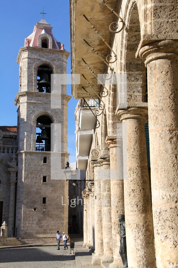 A stone bell tower and columns in Cathedral square