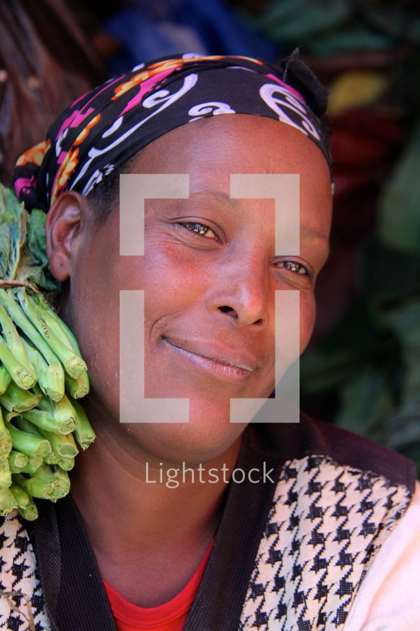 Face of a woman in an African market  [For similar search Ethnic Face Smile]