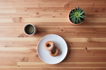 donuts on a plate and coffee cup 