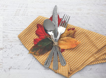 silverware, fall leaves, and napkin 