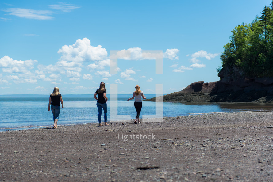 women exploring a shore 