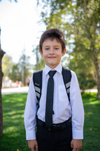 portrait of a little boy in dress clothes 