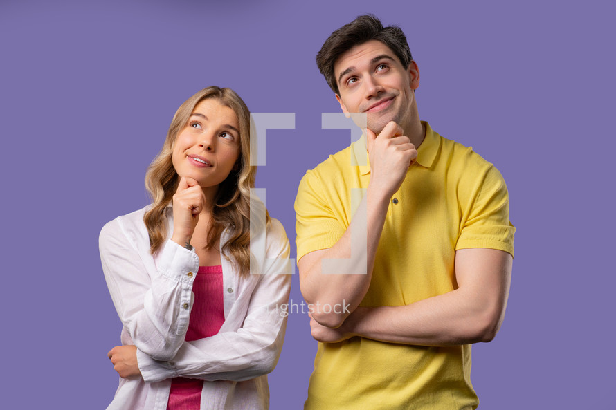 Thinking around woman and man on violet background. Smart student girl and boy couple finding answer or trying to remember what forgot, memory concept. High quality 