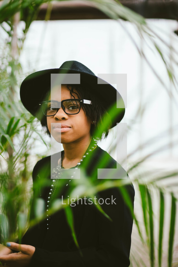 An African American woman in a black hat 