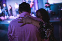 hugs during a worship service 
