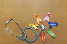 stethoscope and colored ribbons 