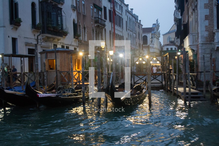 docked gondolas in Venice at night 