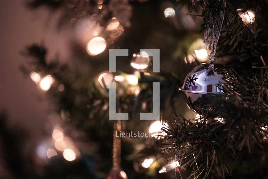 bokeh Christmas lights on a Christmas tree and ornaments 