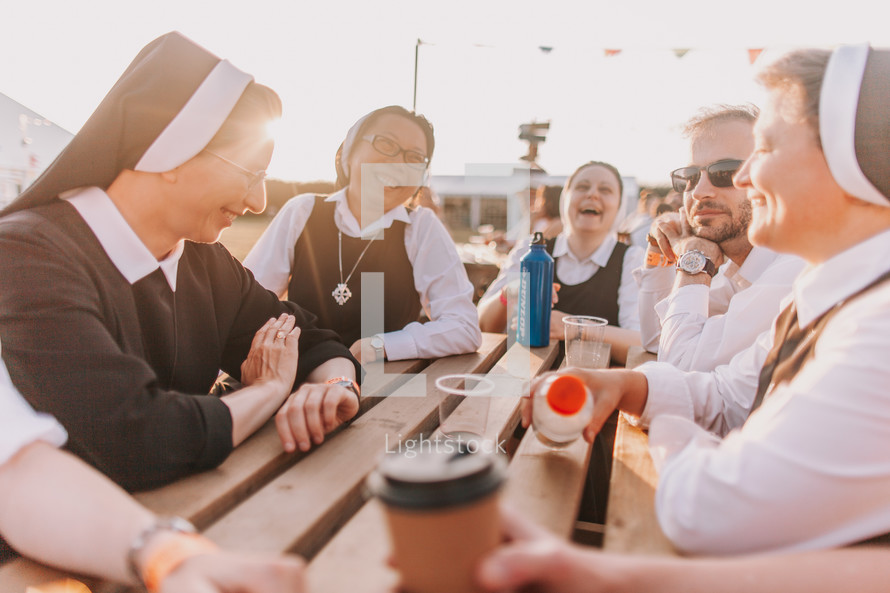 group of nuns talking and laughing in conversation 