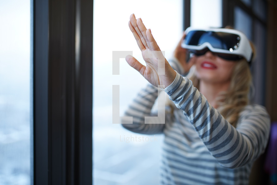 a woman wearing VR glasses 