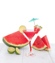 Drink of watermelon juice with lime slice on white background