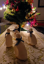 Ceramic duck napkin holders by small Christmas tree