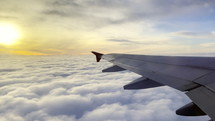 Wing of airplane flying through a cloud