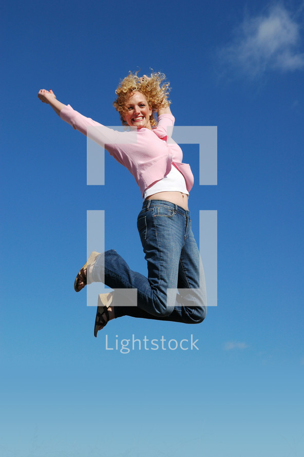 woman leaping into the air 