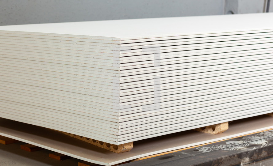 stacked drywall boards 