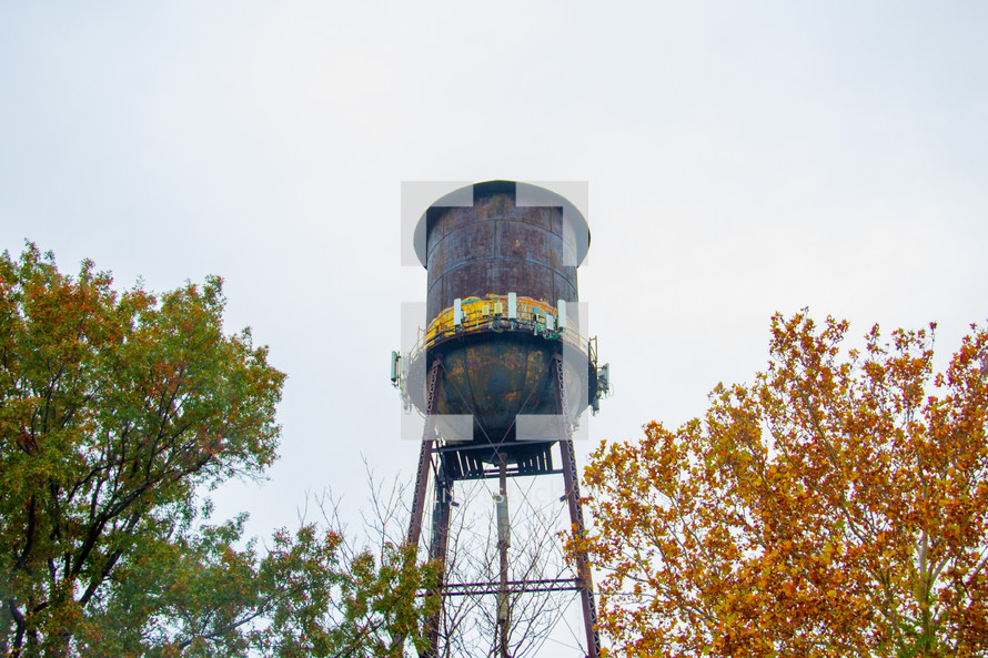 rural water tower and fall trees 