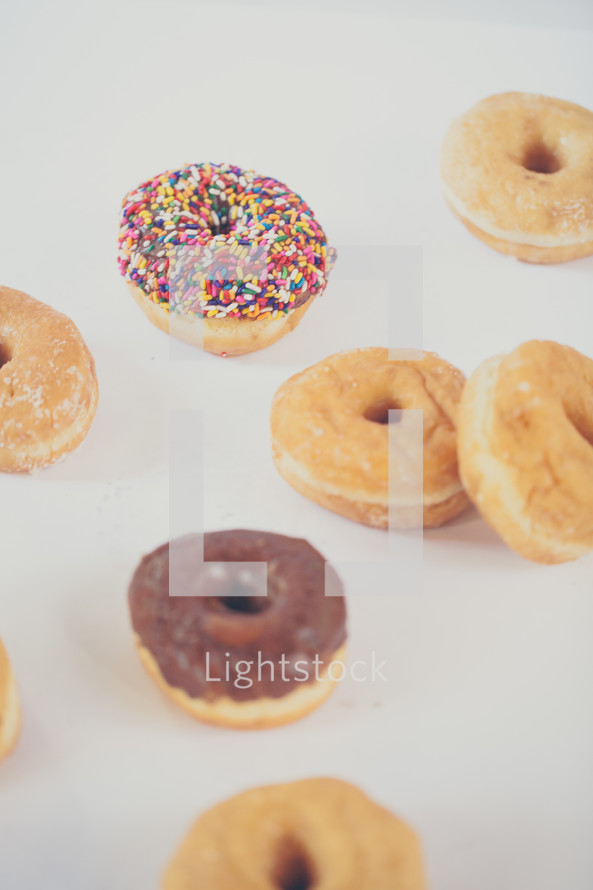 sprinkled donut and donuts on a white background 